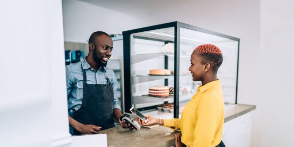 Woman paying at counter